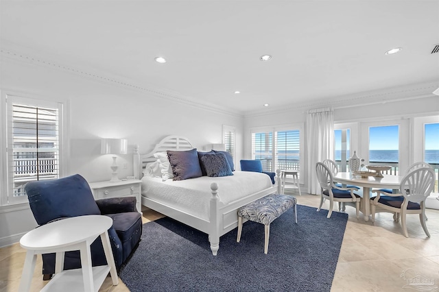 bedroom featuring crown molding and a water view