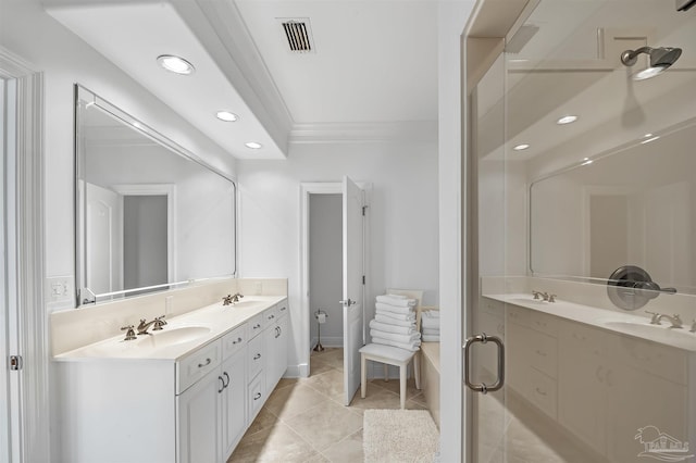 bathroom featuring vanity, tile patterned flooring, crown molding, and a shower with shower door