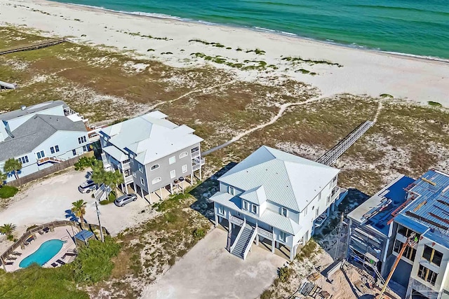 birds eye view of property featuring a view of the beach and a water view