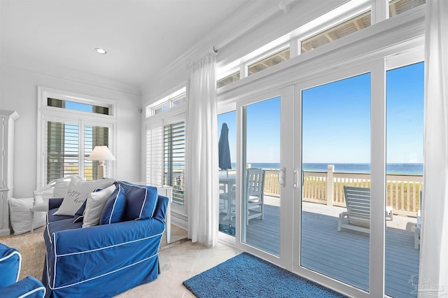 sunroom / solarium with a water view