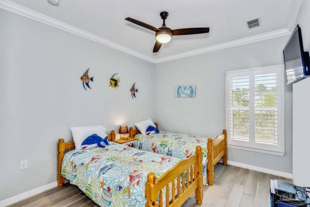 14390 Cordgrass Ln, Pensacola, FL 32507 - bedroom with baseboards, wood finished floors, visible vents, and ornamental molding