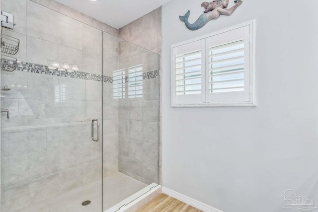 14390 Cordgrass Ln, Pensacola, FL 32507 - bathroom with a shower stall, wood finished floors, and baseboards