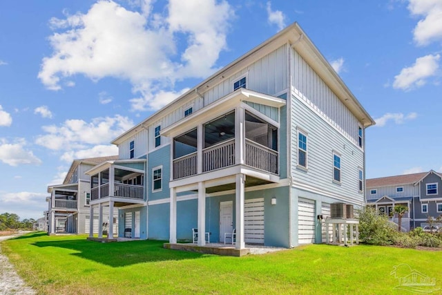 14390 Cordgrass Ln, Pensacola, FL 32507 - back of property featuring a yard and board and batten siding