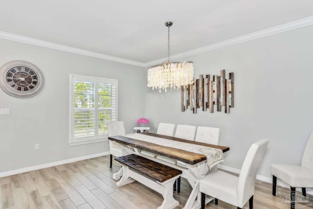 14390 Cordgrass Ln, Pensacola, FL 32507 - dining area with light wood-style flooring, a notable chandelier, and ornamental molding
