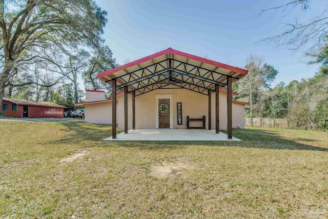 exterior space featuring a yard and a patio