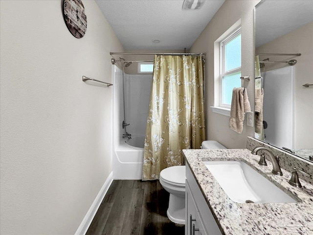 full bathroom with toilet, shower / bath combination with curtain, a textured ceiling, vanity, and hardwood / wood-style flooring