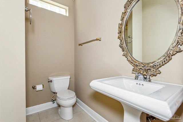 bathroom featuring tile patterned floors, sink, and toilet