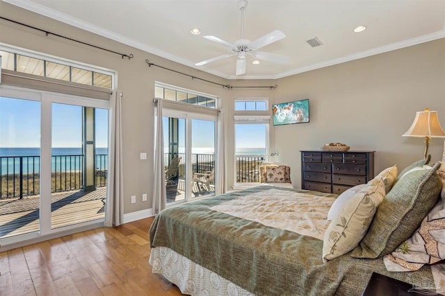 bedroom featuring access to exterior, ceiling fan, crown molding, light hardwood / wood-style floors, and a water view