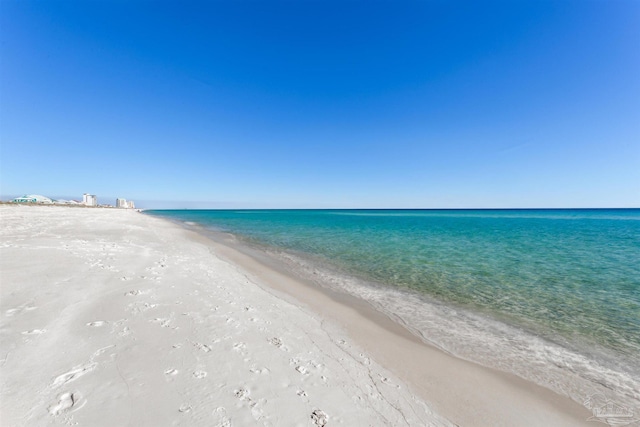 property view of water featuring a beach view