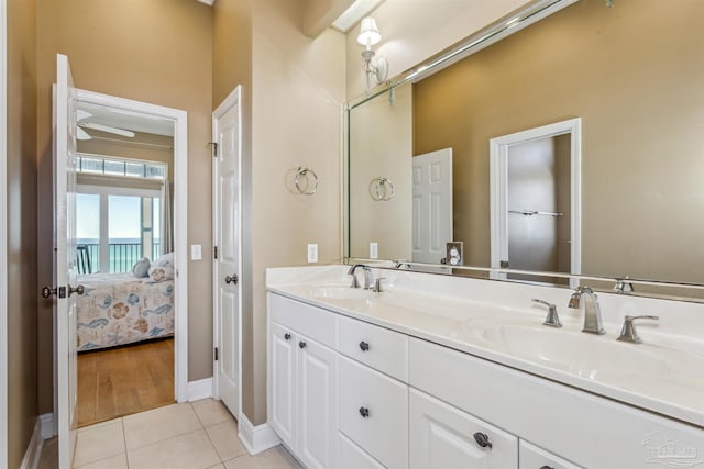 bathroom with tile patterned floors and vanity