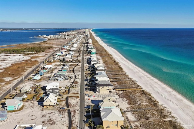 birds eye view of property featuring a beach view and a water view