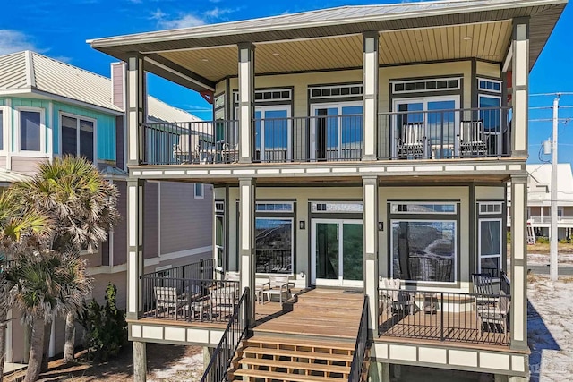 exterior space with a porch and a balcony