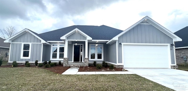 view of front of house with a front yard and a garage