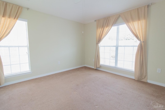 7101 Joy St Unit J5, Pensacola, FL 32504 - empty room with light carpet and baseboards