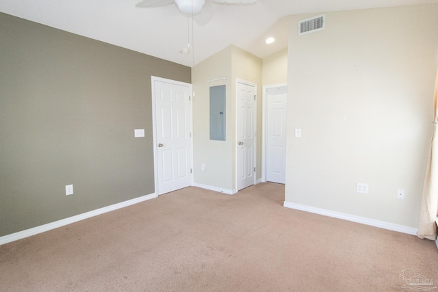 7101 Joy St Unit J5, Pensacola, FL 32504 - unfurnished room featuring electric panel, light carpet, a ceiling fan, baseboards, and vaulted ceiling