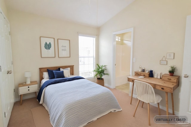 7101 Joy St Unit J5, Pensacola, FL 32504 - bedroom with light colored carpet, baseboards, lofted ceiling, and ensuite bath