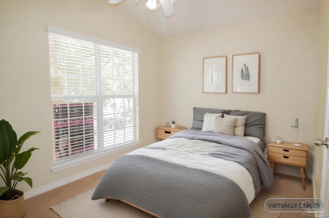 7101 Joy St Unit J5, Pensacola, FL 32504 - bedroom featuring carpet flooring, multiple windows, lofted ceiling, baseboards, and a ceiling fan