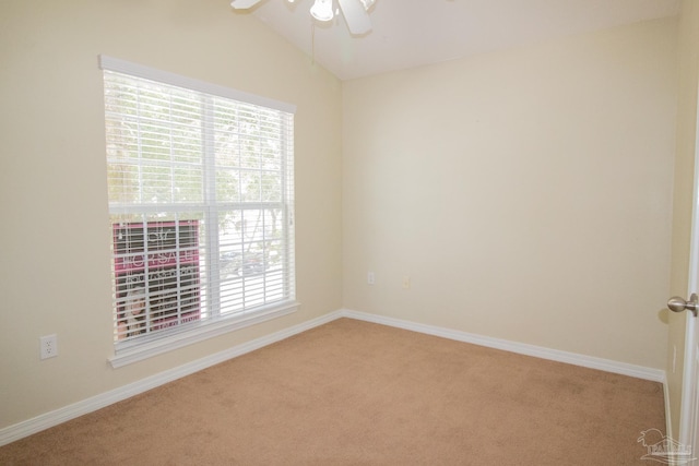 7101 Joy St Unit J5, Pensacola, FL 32504 - spare room featuring light colored carpet, ceiling fan, plenty of natural light, vaulted ceiling, and baseboards