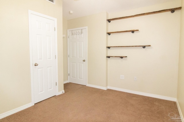 7101 Joy St Unit J5, Pensacola, FL 32504 - unfurnished bedroom with light colored carpet and baseboards