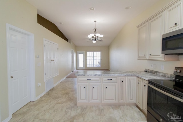 7101 Joy St Unit J5, Pensacola, FL 32504 - kitchen with stainless steel appliances, a chandelier, a peninsula, vaulted ceiling, and decorative light fixtures