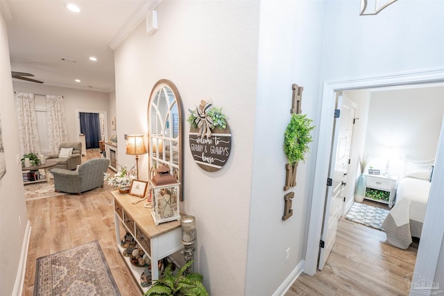 hall with light hardwood / wood-style floors