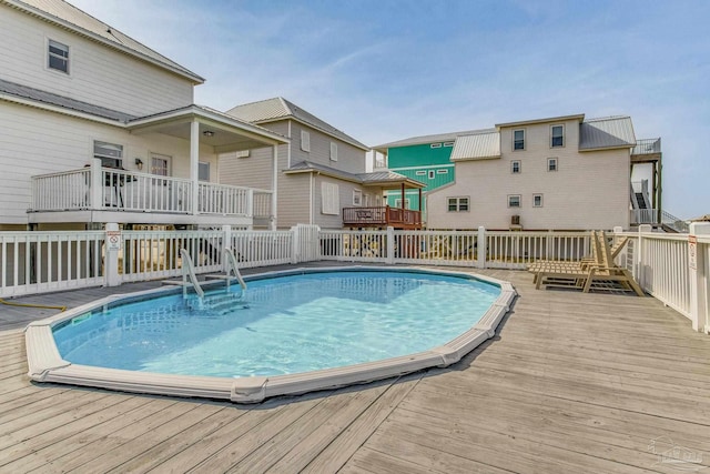 view of pool with a wooden deck
