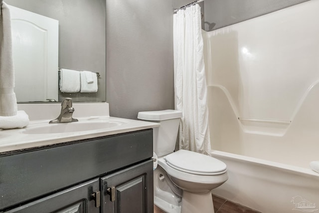 full bathroom with vanity, shower / bathtub combination with curtain, tile patterned floors, and toilet