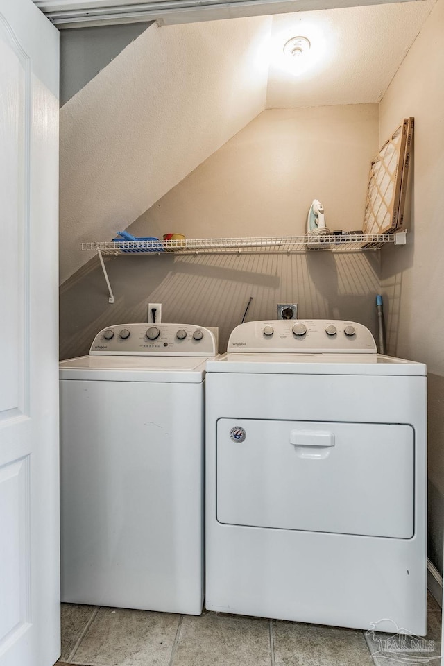 clothes washing area featuring washing machine and dryer