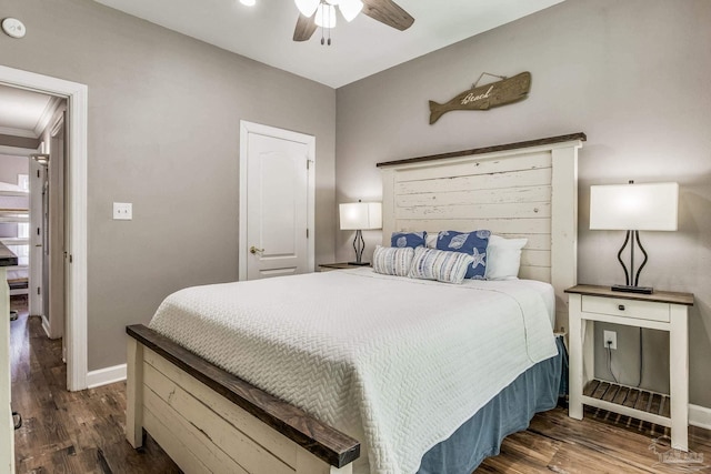 bedroom featuring dark hardwood / wood-style flooring and ceiling fan