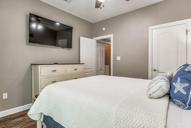 bedroom with ceiling fan and dark hardwood / wood-style flooring