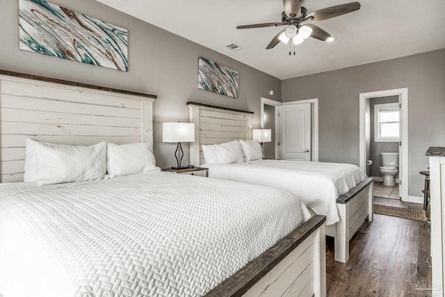 bedroom featuring dark wood-type flooring, ceiling fan, and ensuite bathroom