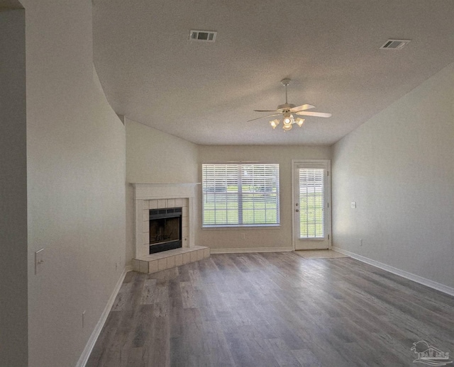 2441 Pine Forest Rd, Pensacola, FL 32533 - unfurnished living room featuring a ceiling fan, wood finished floors, baseboards, and a tile fireplace