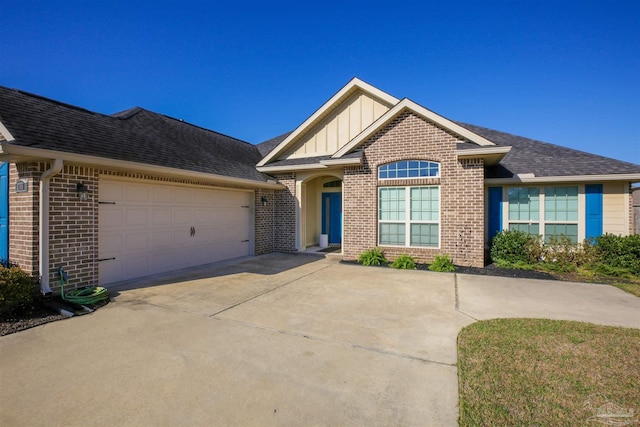 view of front of property with concrete driveway, an attached garage, brick siding, and board and batten siding