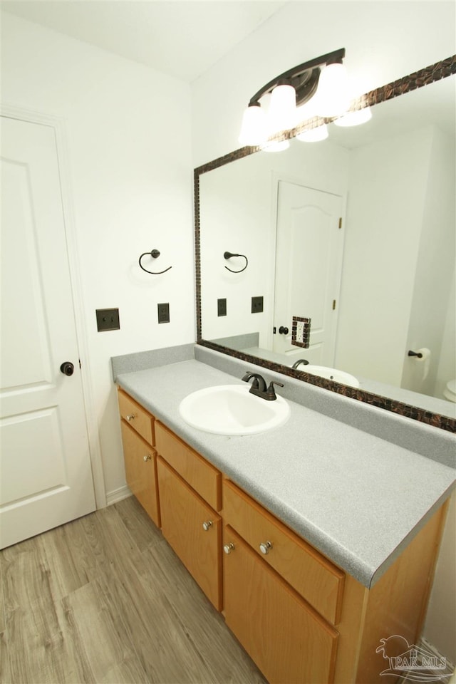 bathroom featuring vanity and hardwood / wood-style flooring