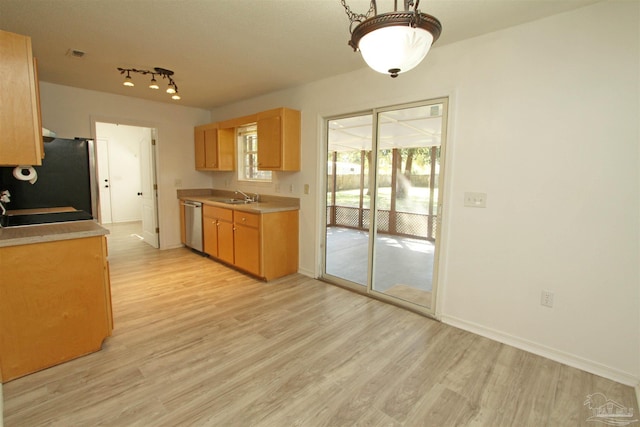 kitchen featuring dishwasher, light hardwood / wood-style floors, fridge, and sink