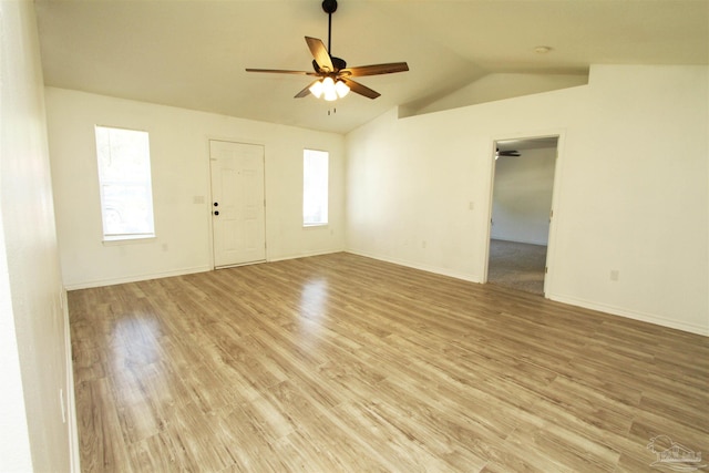 interior space featuring light hardwood / wood-style flooring, vaulted ceiling, and ceiling fan