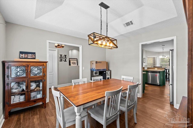 2863 Wallace Lake Rd, Pace, FL 32571 - dining room with a textured ceiling, visible vents, baseboards, a chandelier, and dark wood-type flooring