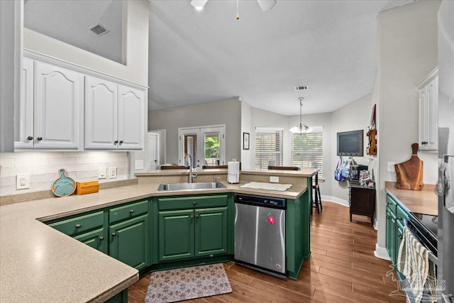 2863 Wallace Lake Rd, Pace, FL 32571 - kitchen with stainless steel dishwasher, a peninsula, green cabinetry, white cabinets, and a sink