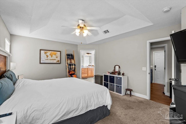 2863 Wallace Lake Rd, Pace, FL 32571 - bedroom with visible vents, ensuite bathroom, ceiling fan, light colored carpet, and a textured ceiling