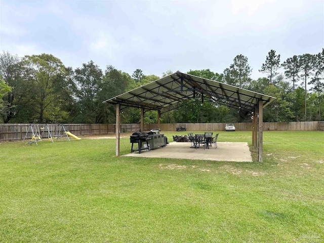 2863 Wallace Lake Rd, Pace, FL 32571 - view of home's community with a patio, a fenced backyard, a playground, and a yard