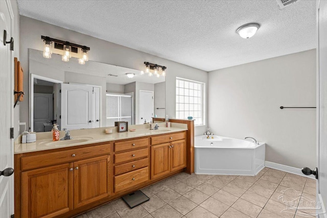 2863 Wallace Lake Rd, Pace, FL 32571 - full bathroom featuring a sink, a textured ceiling, and double vanity