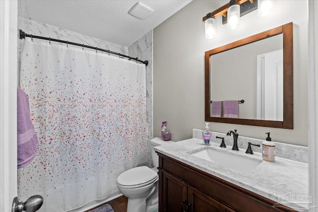 2863 Wallace Lake Rd, Pace, FL 32571 - bathroom featuring a textured ceiling, wood finished floors, vanity, toilet, and a shower with shower curtain