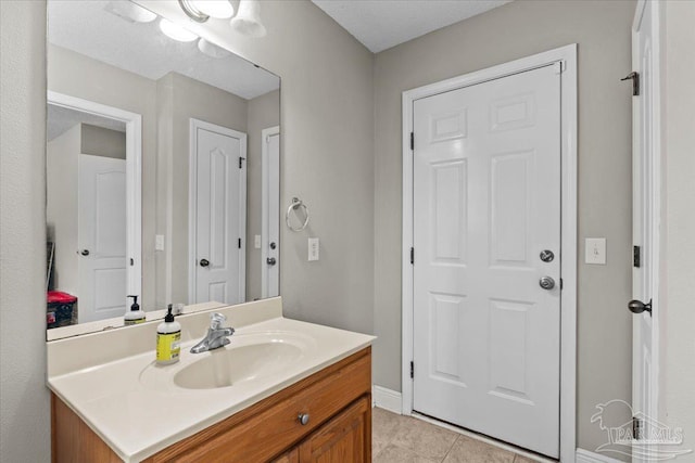 2863 Wallace Lake Rd, Pace, FL 32571 - bathroom with vanity, baseboards, and tile patterned flooring
