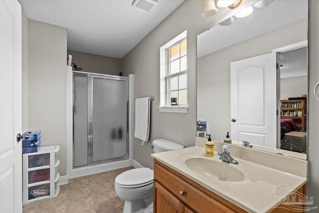 2863 Wallace Lake Rd, Pace, FL 32571 - bathroom featuring visible vents, vanity, toilet, a textured ceiling, and a shower stall