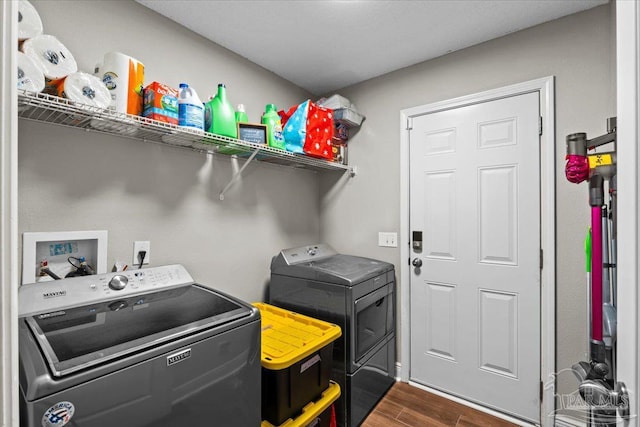 2863 Wallace Lake Rd, Pace, FL 32571 - laundry room with separate washer and dryer, laundry area, and dark wood-type flooring