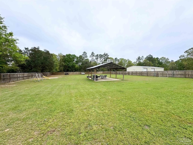 2863 Wallace Lake Rd, Pace, FL 32571 - view of yard with a fenced backyard, a detached carport, and a patio area