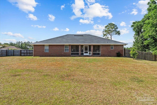 2863 Wallace Lake Rd, Pace, FL 32571 - back of house with a lawn, brick siding, and a fenced backyard