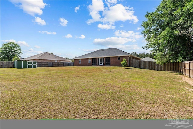 2863 Wallace Lake Rd, Pace, FL 32571 - view of yard featuring a fenced backyard, a shed, and an outbuilding