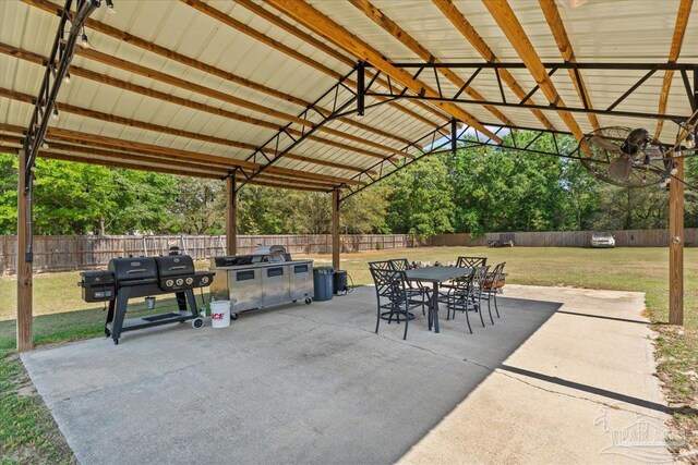 2863 Wallace Lake Rd, Pace, FL 32571 - view of patio / terrace with a fenced backyard, exterior kitchen, and outdoor dining space