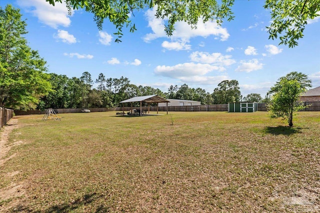 2863 Wallace Lake Rd, Pace, FL 32571 - view of yard featuring a fenced backyard, an outbuilding, and a storage shed
